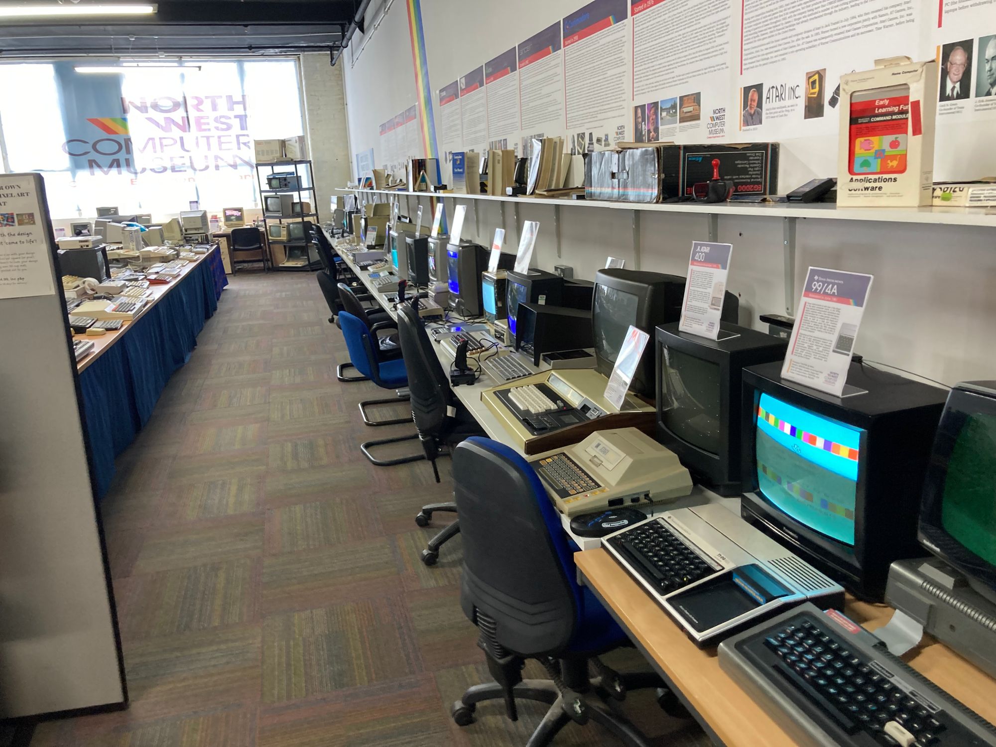 A bank of dozens of vintage computers, all switched on and hooked up to screens